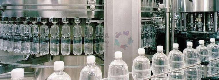 PET bottles running through a filling machine on a MEPA Packaging bottling line